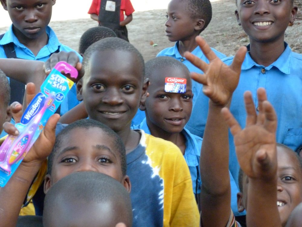 Uphill pupils show off their teeth and toothrushes