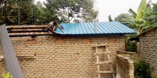 Putting the roof onto the latrine