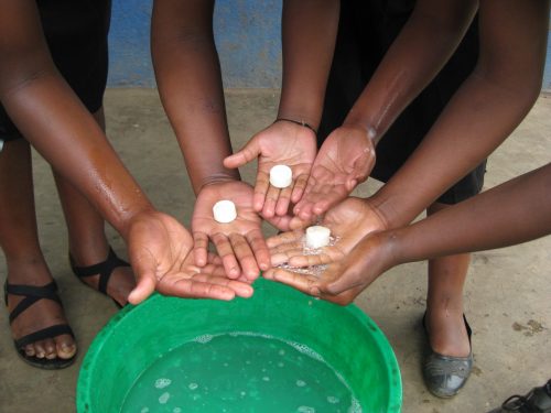 pupils washing with soap in uganda