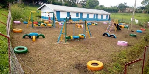 uphill kindergarten site with classroom block and playground