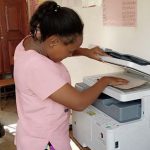Using the new photocopier at uphill junior school in uganda