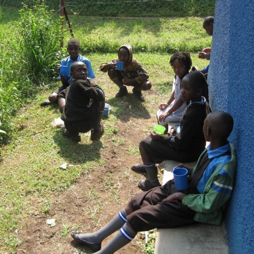 enjoying daily porridge in school