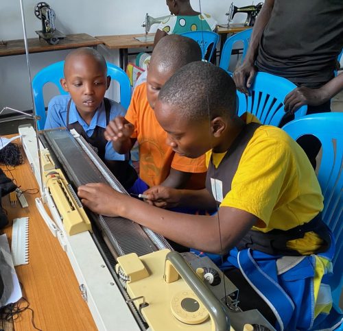 making school jumpers with a knitting machine